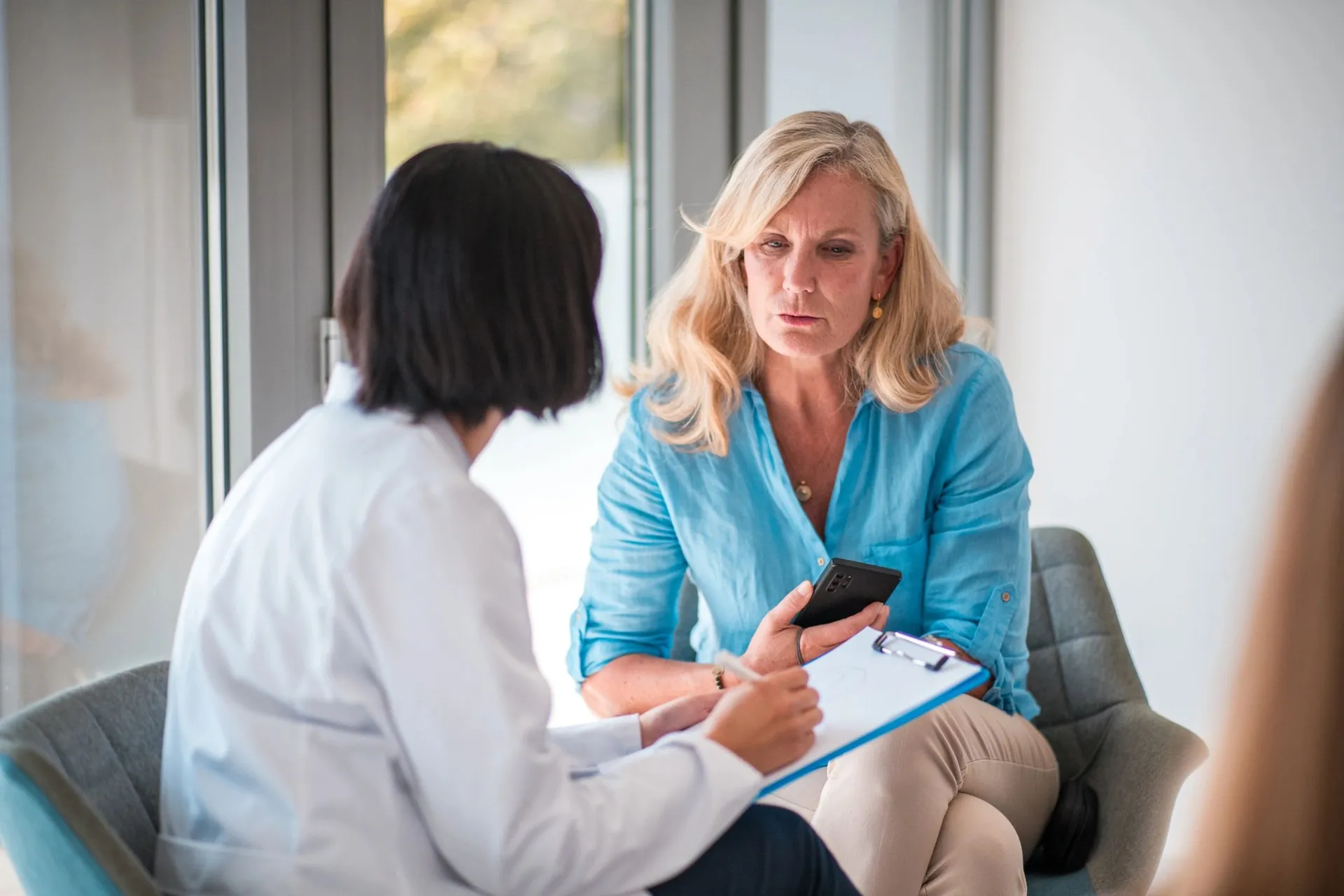 Healthcare professional with patient at Refine DPC